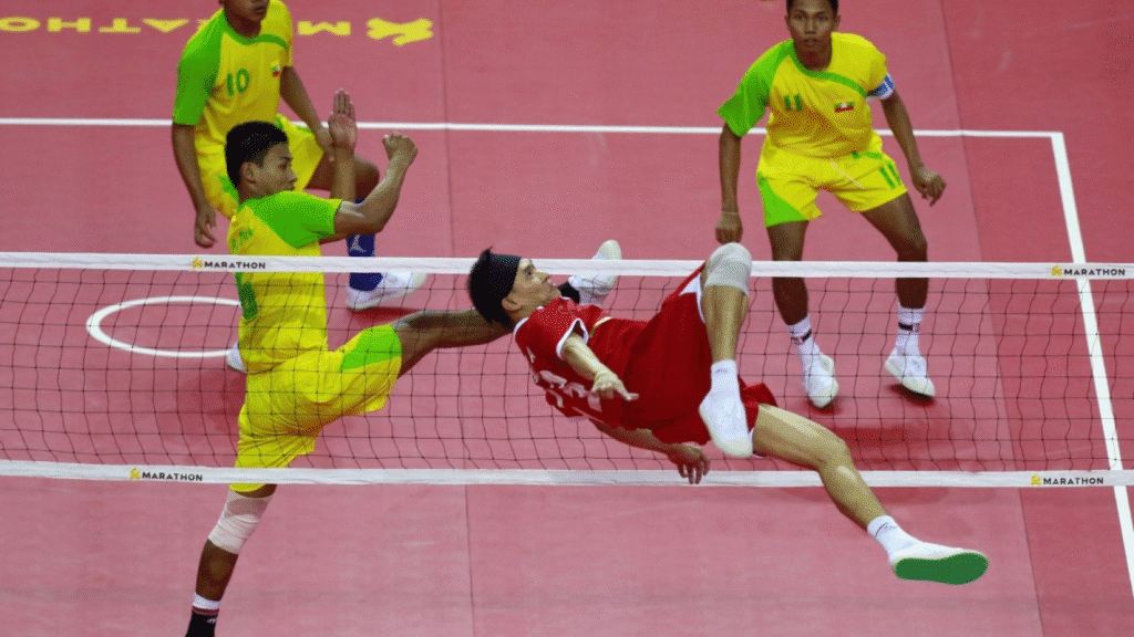 Athletes performing acrobatic kicks during a Sepak Takraw match, one of Asia’s most exciting unusual sports.