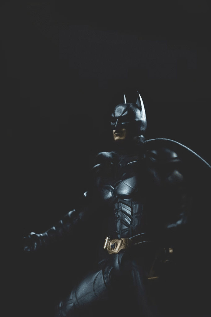 Batman superhero in an iconic costume, standing in Gotham City.