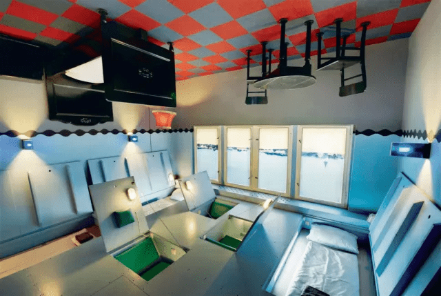 Artistically designed upside-down bedroom at Propeller Island City Lodge in Berlin, German