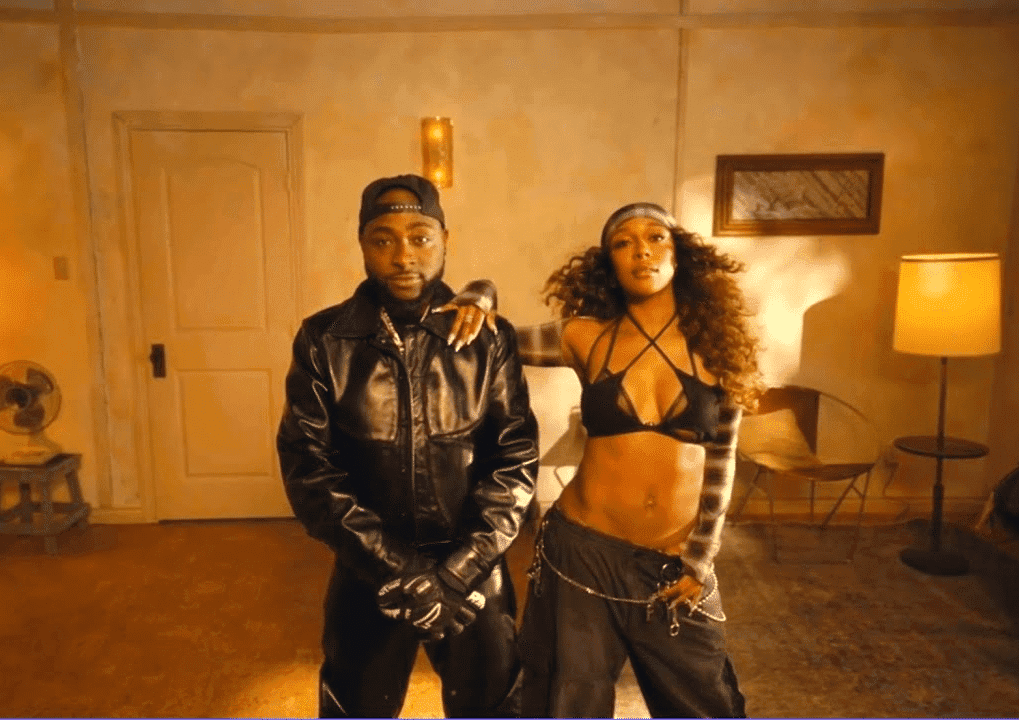 Davido and Victoria Monét sharing the stage during a 2025 music award ceremony performance, highlighting their hit collaboration.