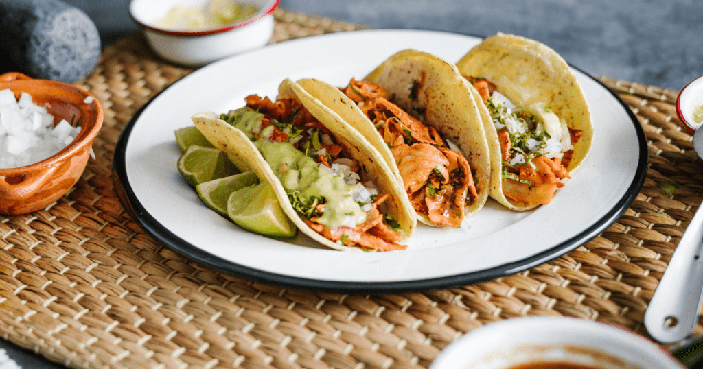 Juicy Tacos al Pastor served with pineapple and salsa, making Mexico one of the best cuisines.