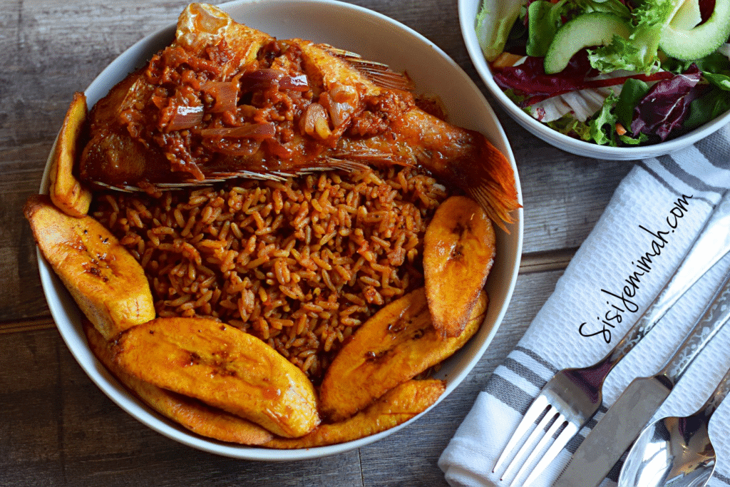 Smoky Nigerian Jollof Rice served with fried plantains, spicy turkey, and hotdog toppings, making Nigeria one of the countries with the best cuisines.